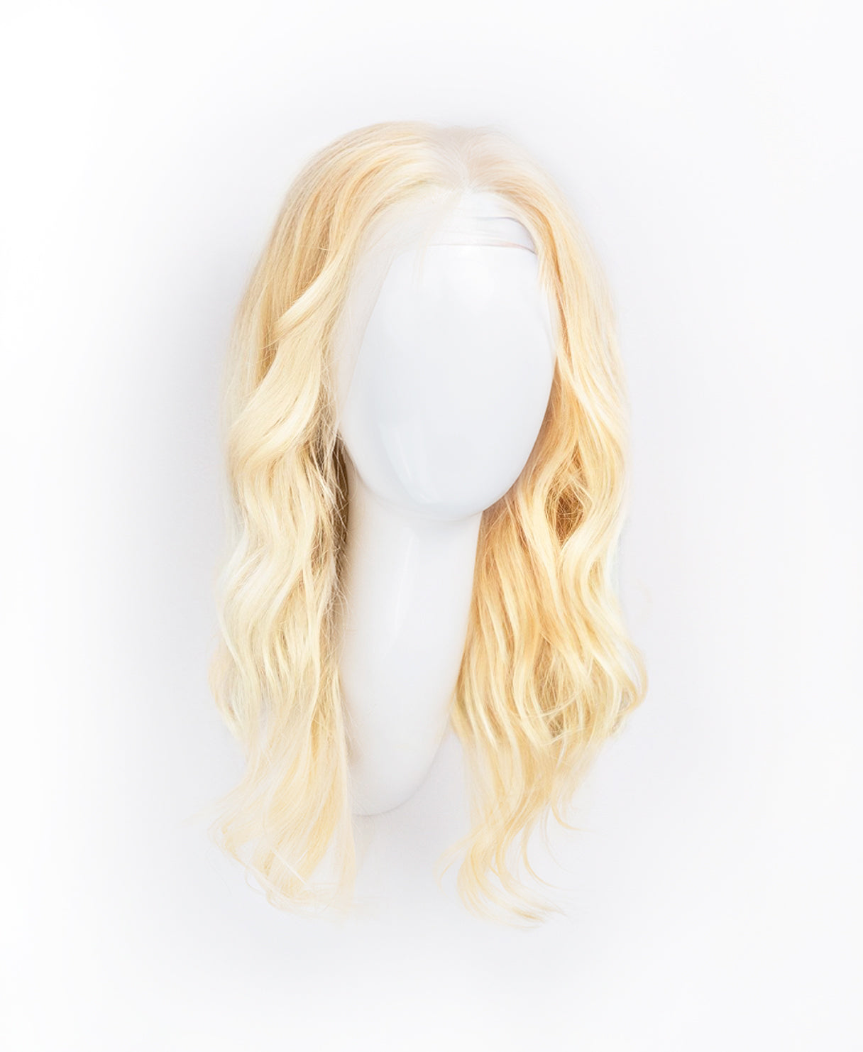 blonde human hair wig on a stand