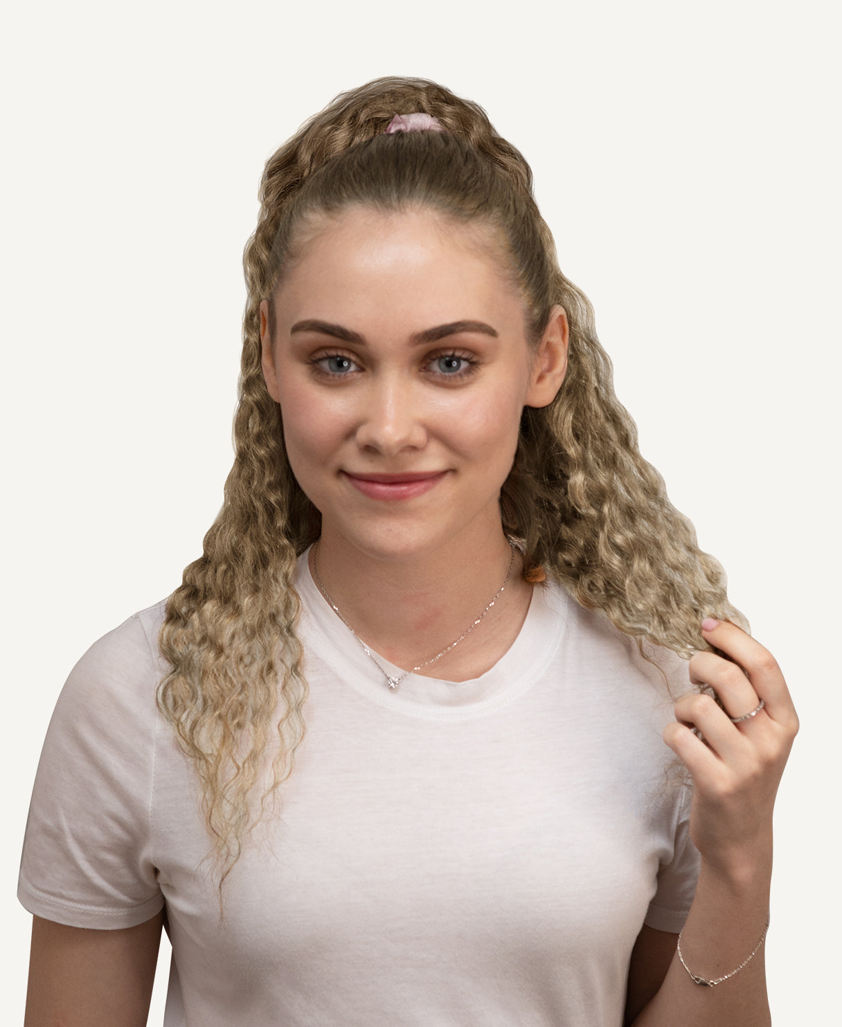 model wearing curly blonde ponytail